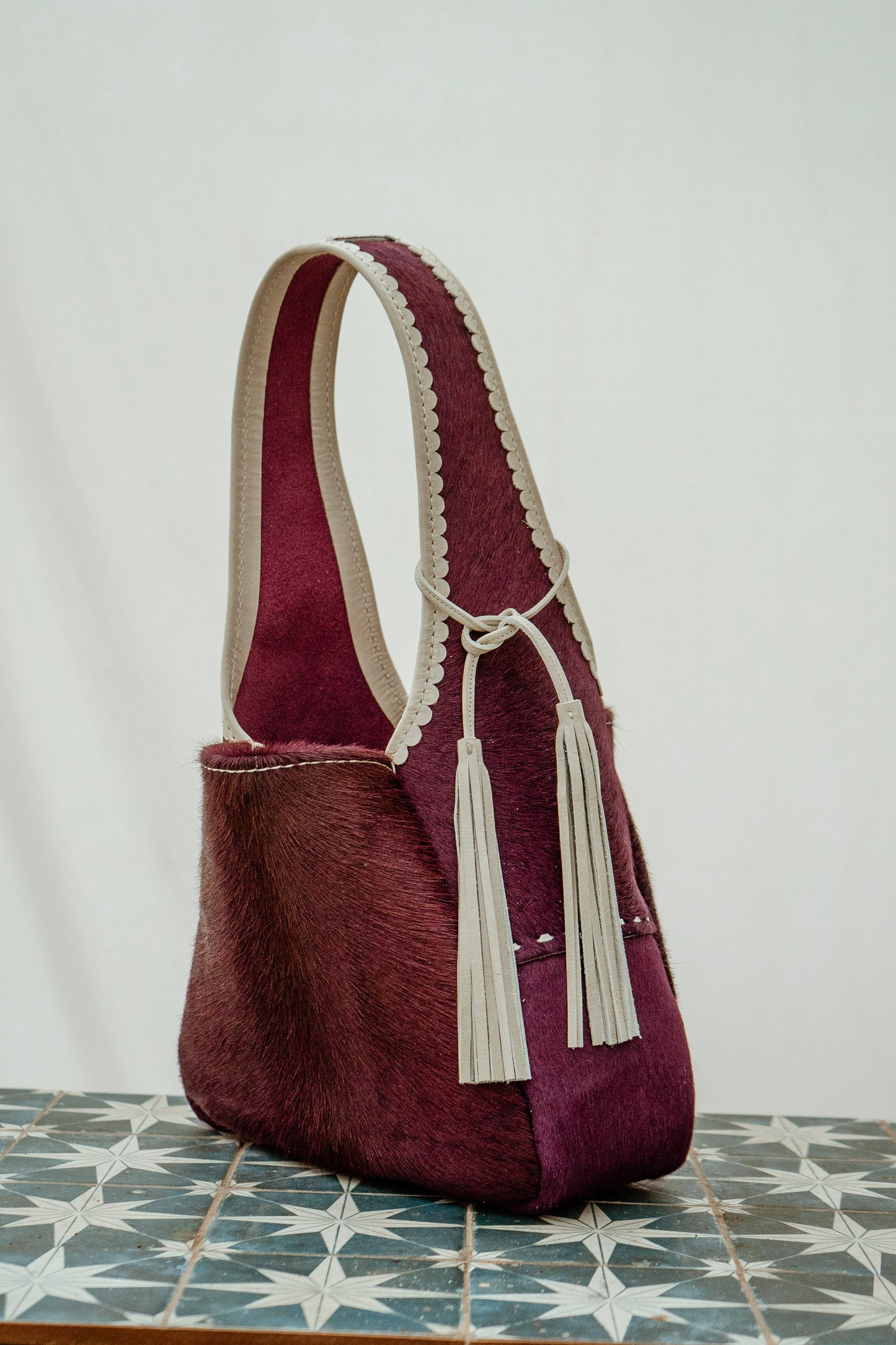Berry Bright buckstitch hobo bag