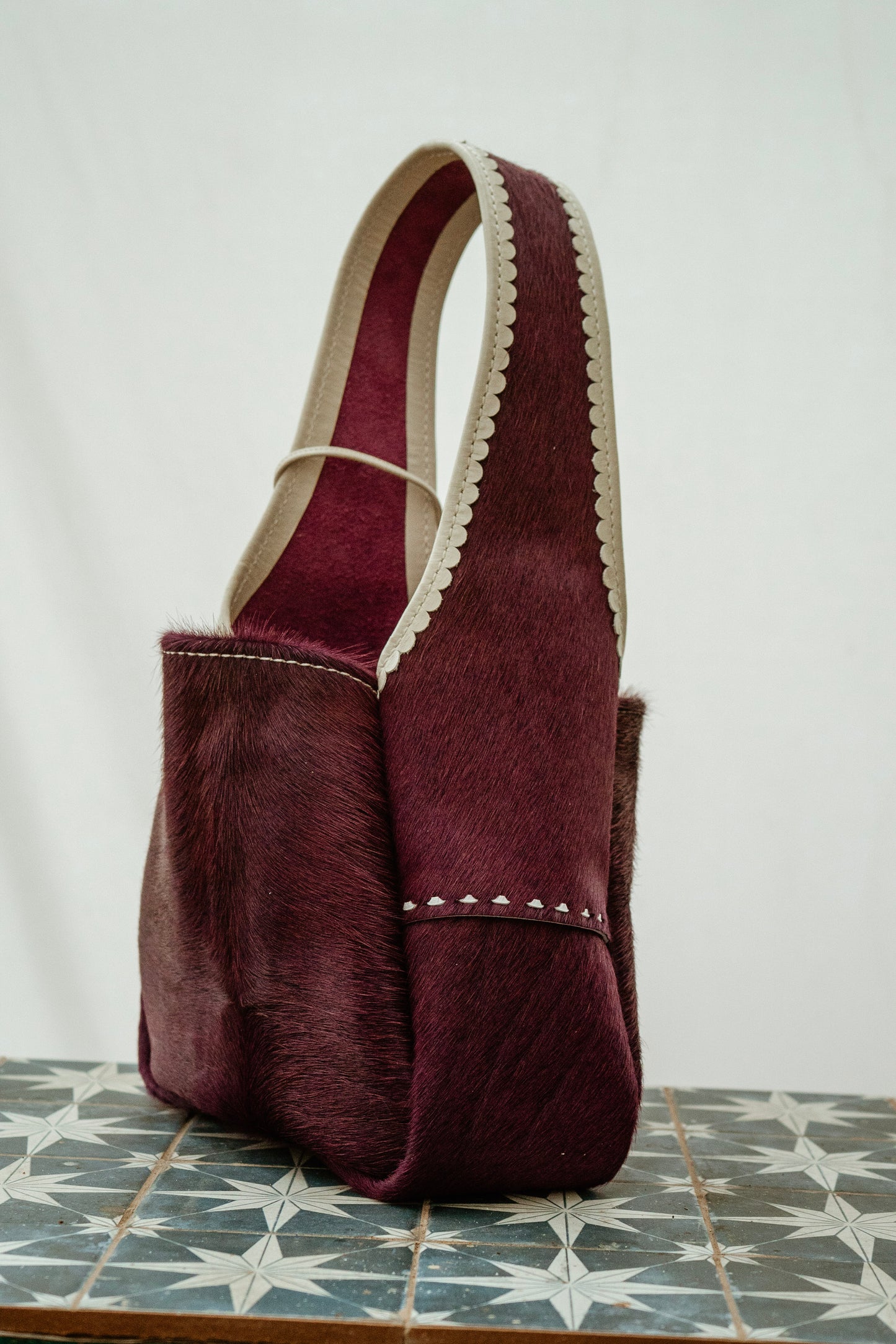 Berry Bright buckstitch hobo bag